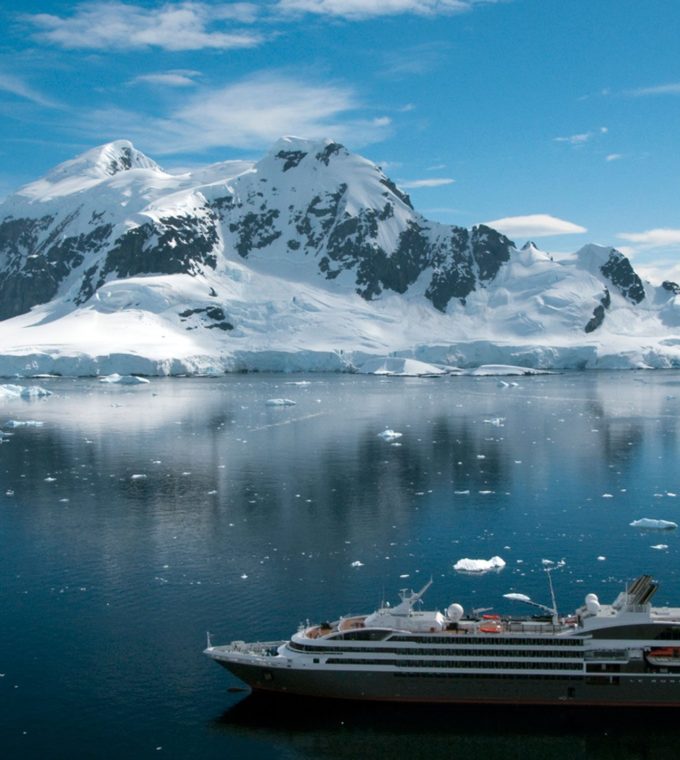 Antarctica iceberg with cruise ship