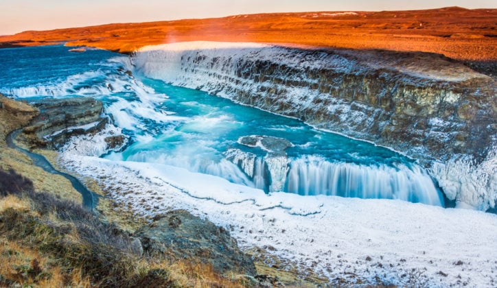 Amazing Icelandic winter landscape of majestic waterfall of frozen Gullfoss