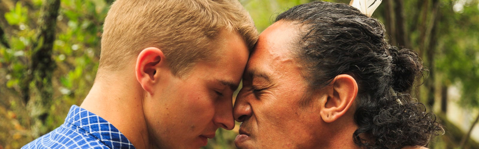 new zealand - maori man and visitor