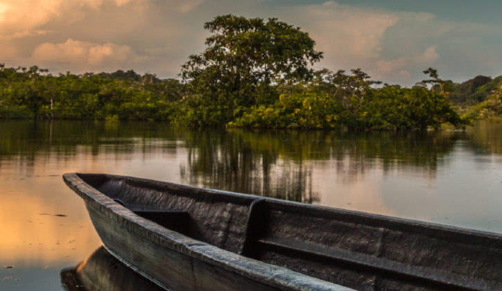 A boat sits on the water amid Ecuador's Amazon