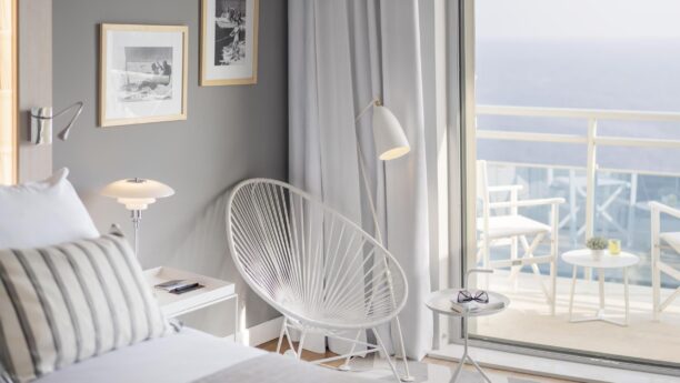 Bedroom area with chairs overlooking the ocean in Croatia Hotel Bellevue Dubrovnik